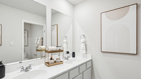 secondary bathroom with dual sink