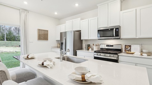 Kitchen with white cabinets and countertops