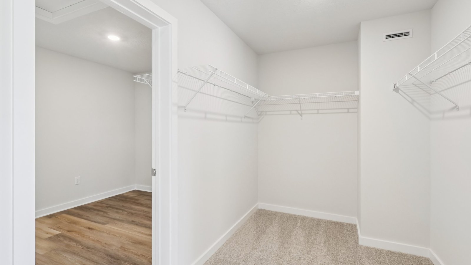 primary walk-in closet with laundry room