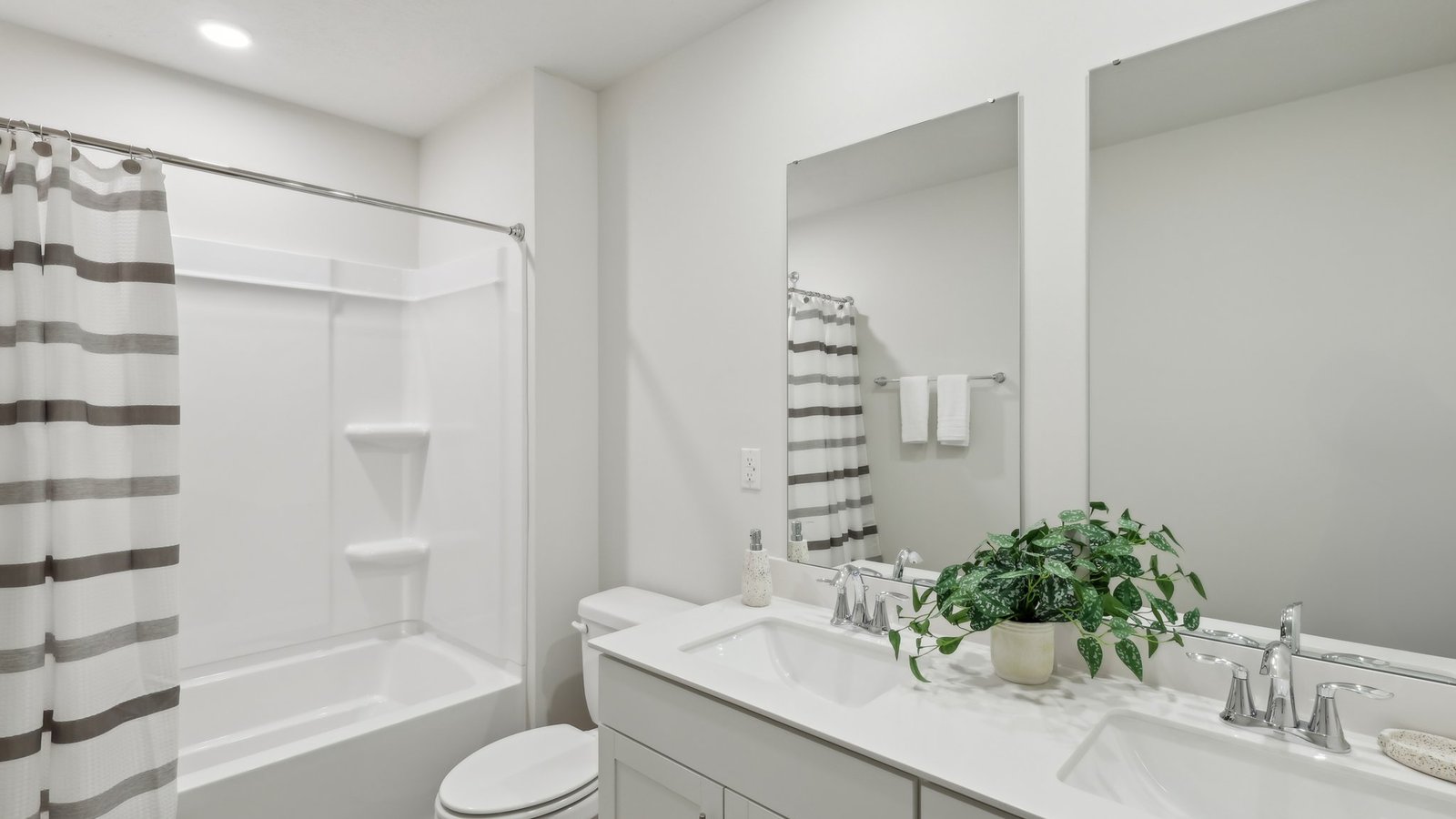 Secondary bathroom with dual vanities