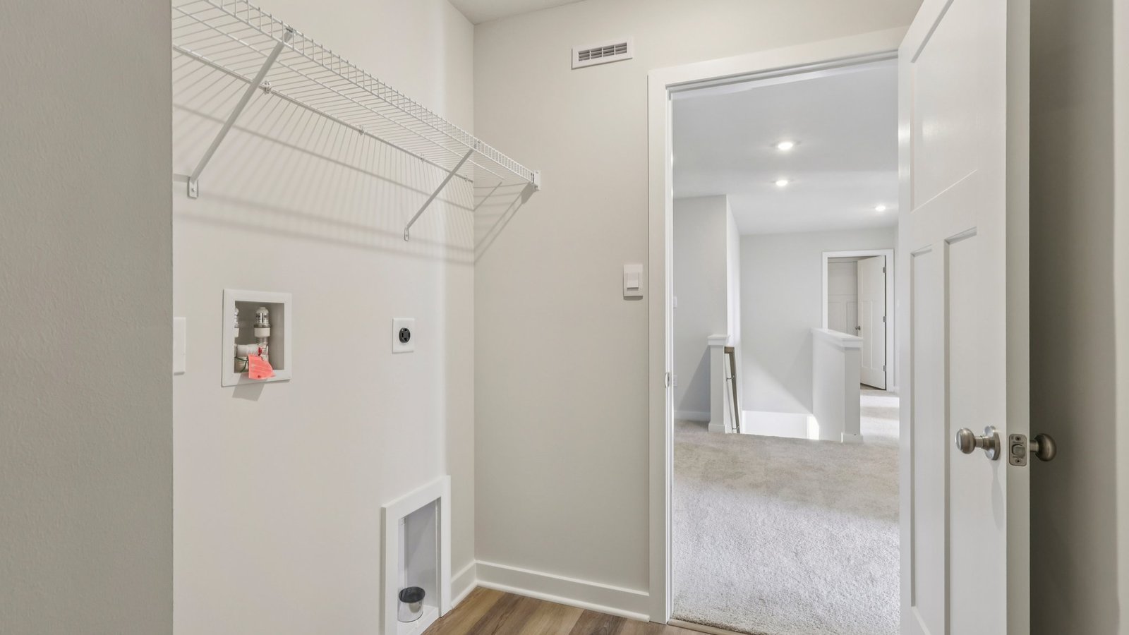 laundry room with wire shelving