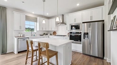 Kitchen with white countertops and cabinets