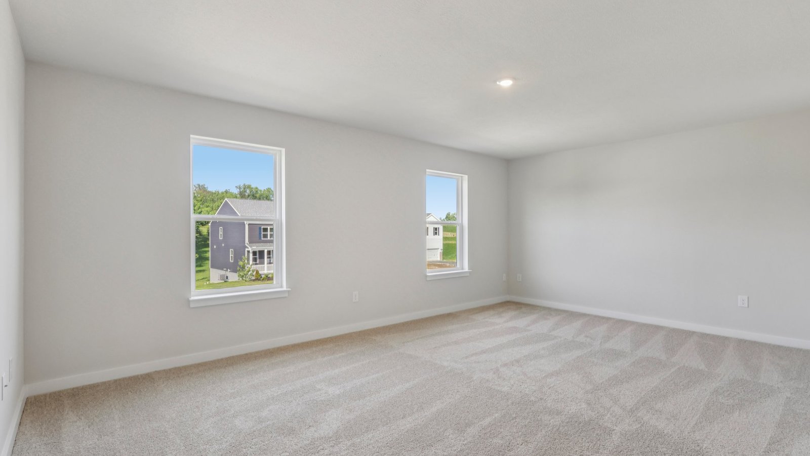 primary suite with large windows