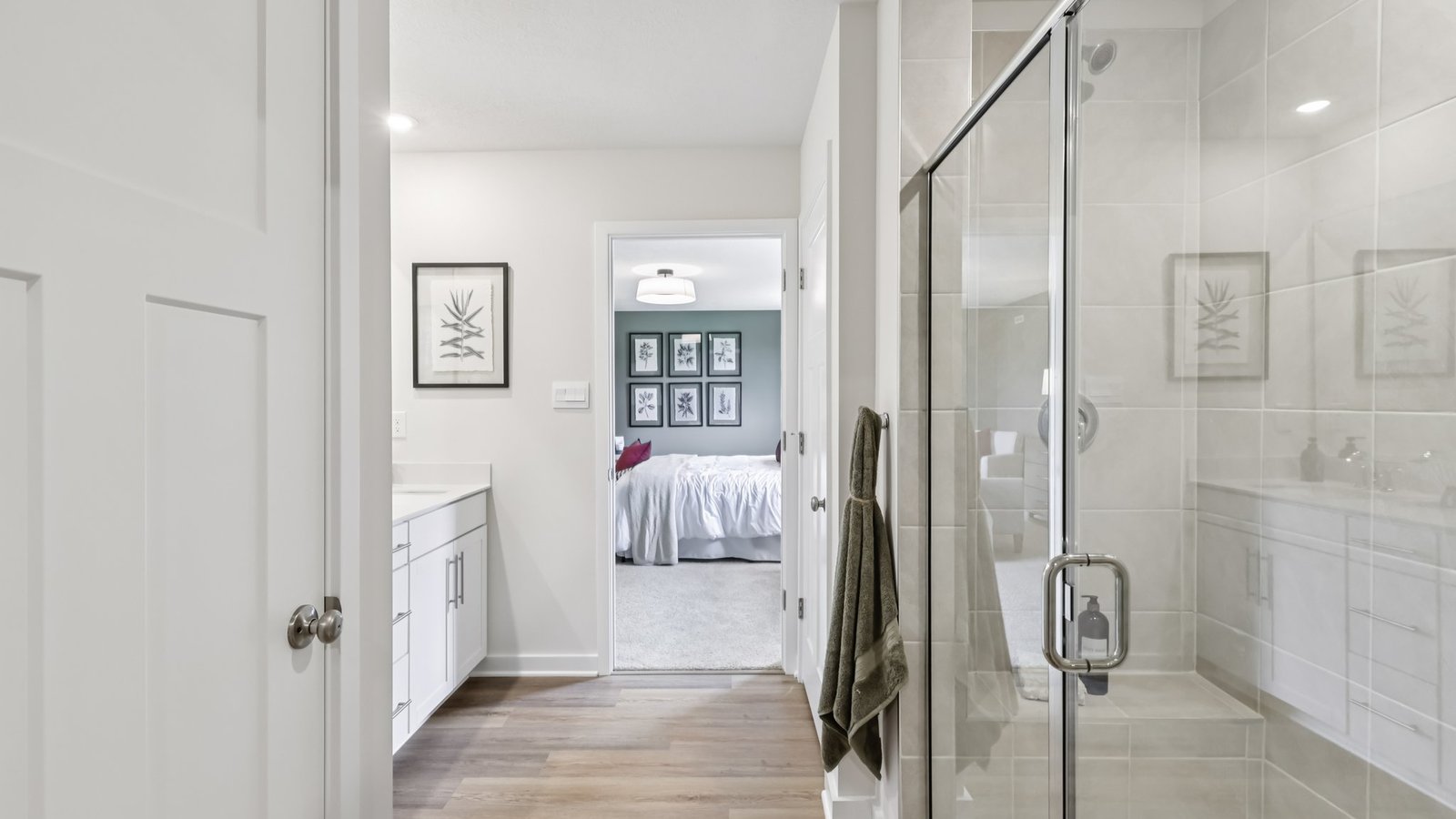 Primary ensuite bathroom with glass shower door