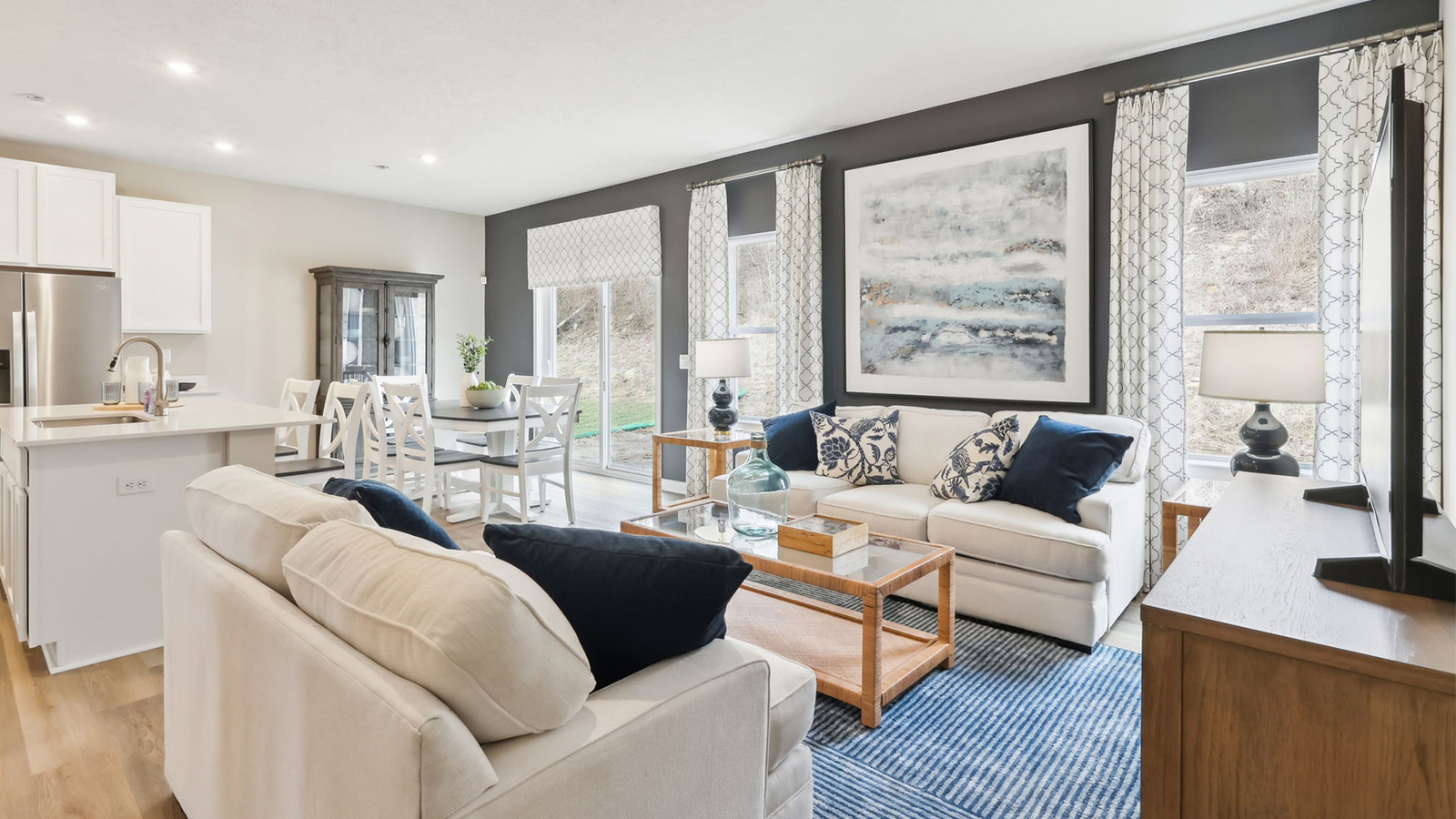 Living room off of dining and kitchen area