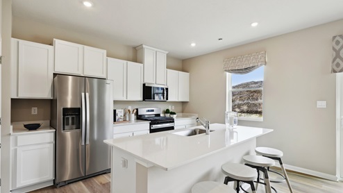 Kitchen with large island and stainless steel appliances