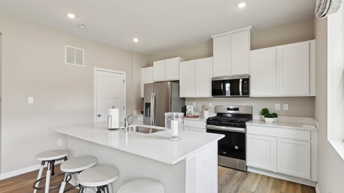 Kitchen with large island and stainless steel appliances