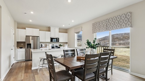 Dining area off of kitchen with sliding glass door