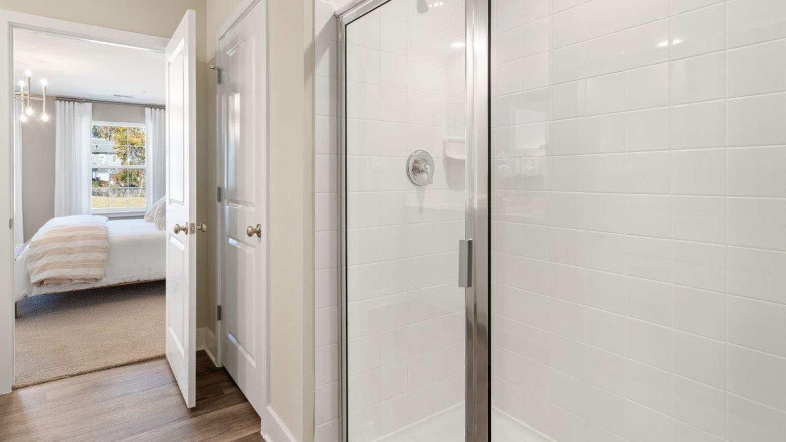 Primary ensuite bathroom sliding glass shower