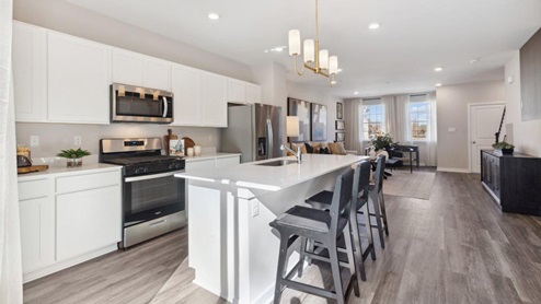 kitchen wiht white cabinets and countertops