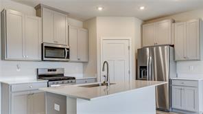 Kitchen with gray cabinets