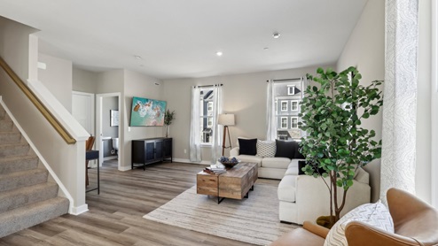 Living room with bonus space and half bath