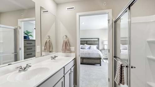 Primary ensuite full bath with glass shower door