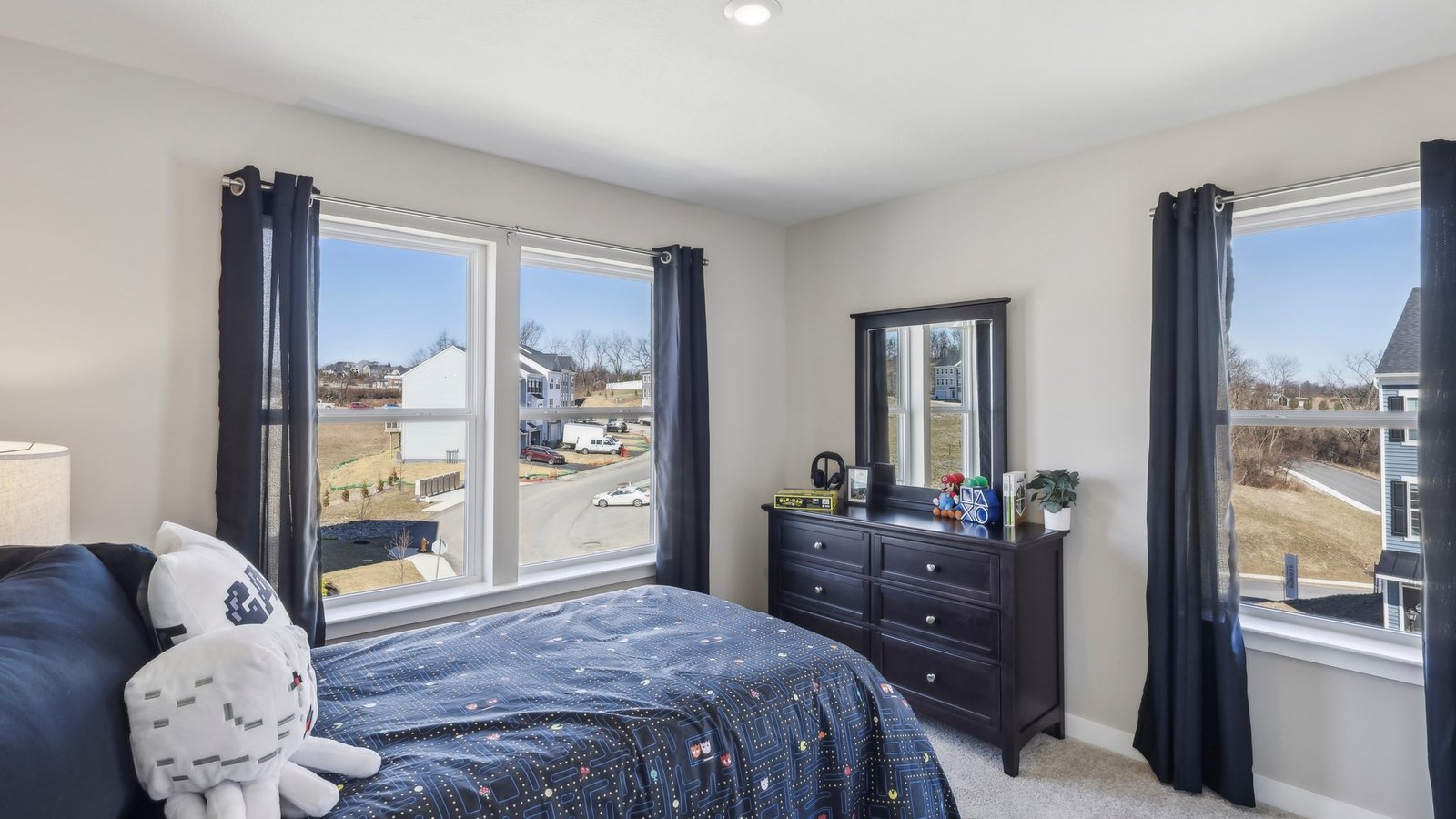 second bedroom with three windows