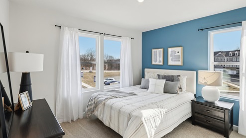 Secondary bedroom with three large windows