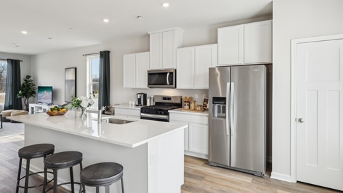 Kitchen with white cabinets and contertops