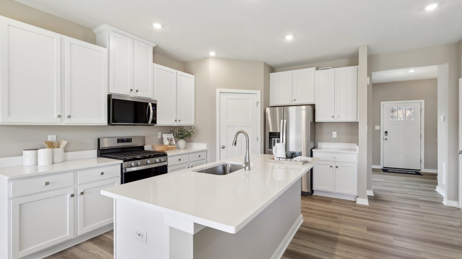 kitchen with white cabinets and countertops