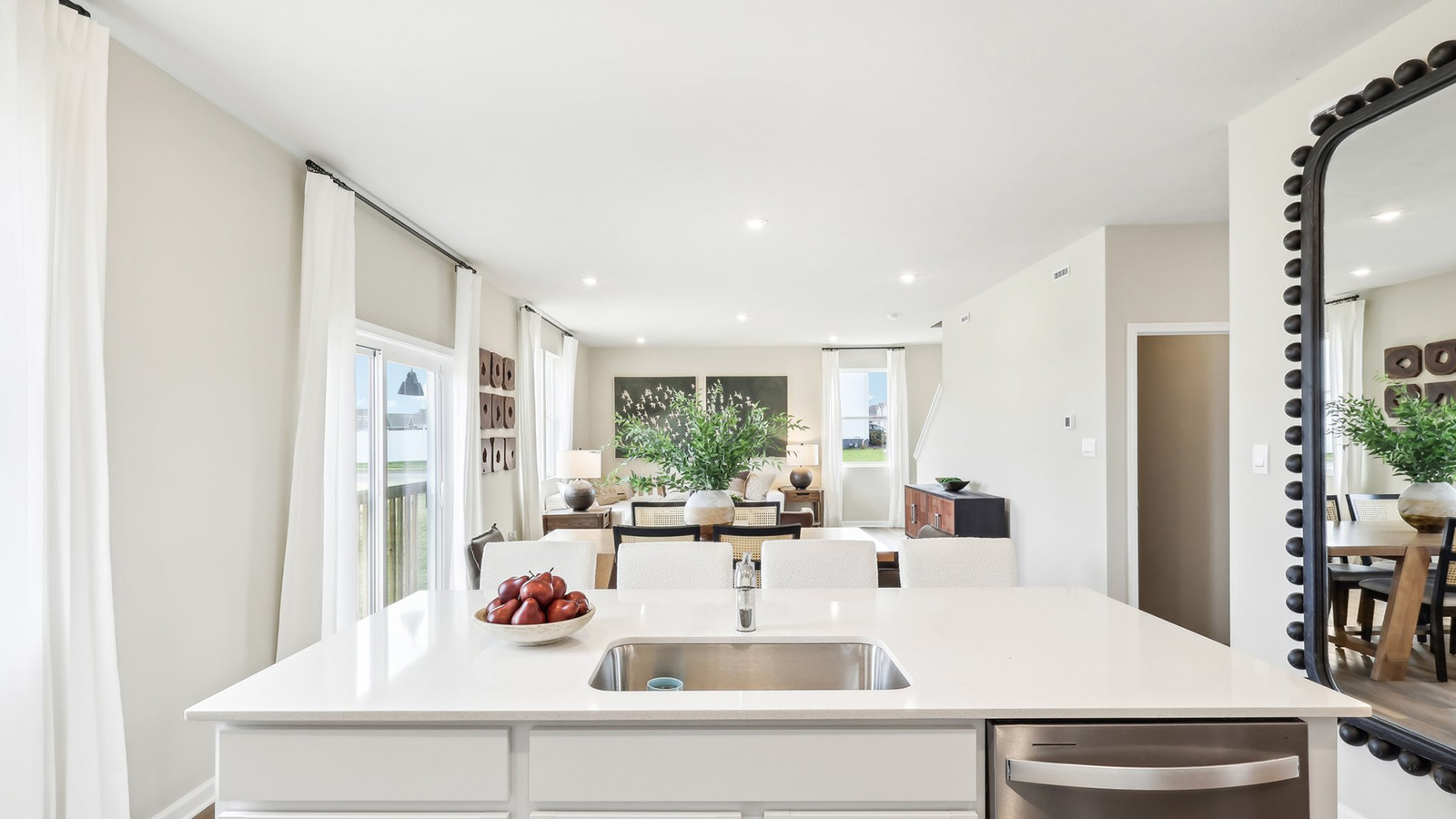 kitchen island overlooking dining and living areas