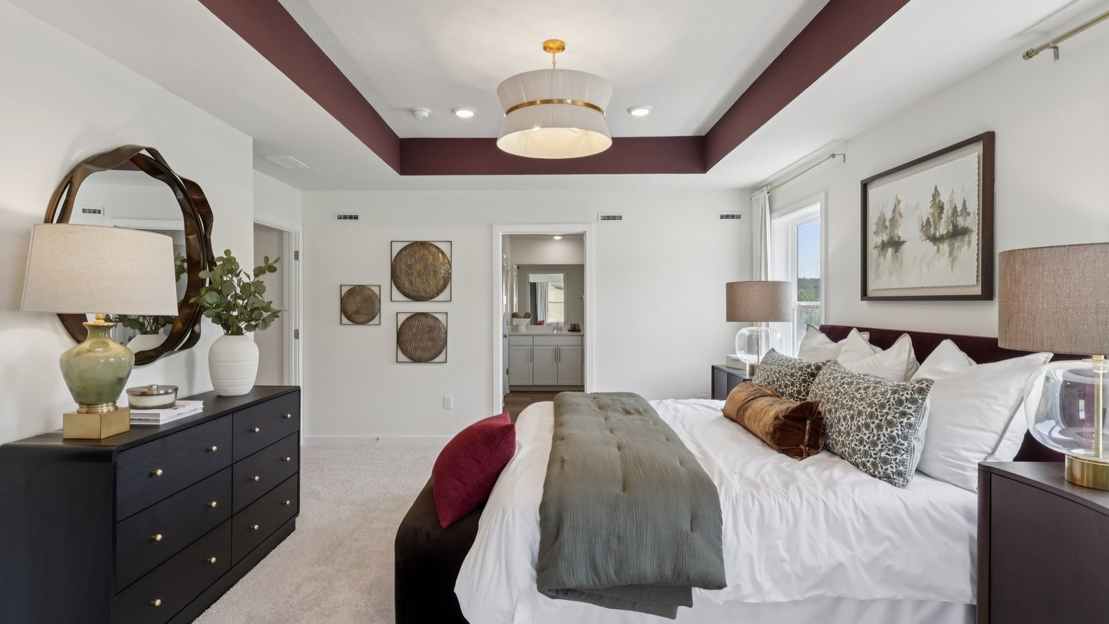 Primary bedroom suite with windows