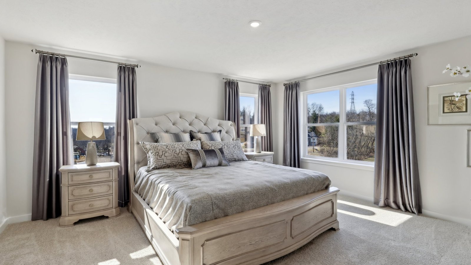 Primary bedroom with large windows