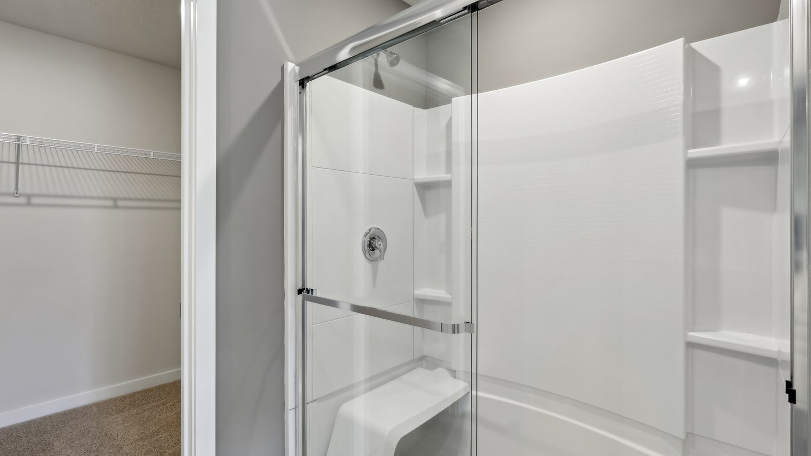 Primary ensuite bathroom with glass shower door