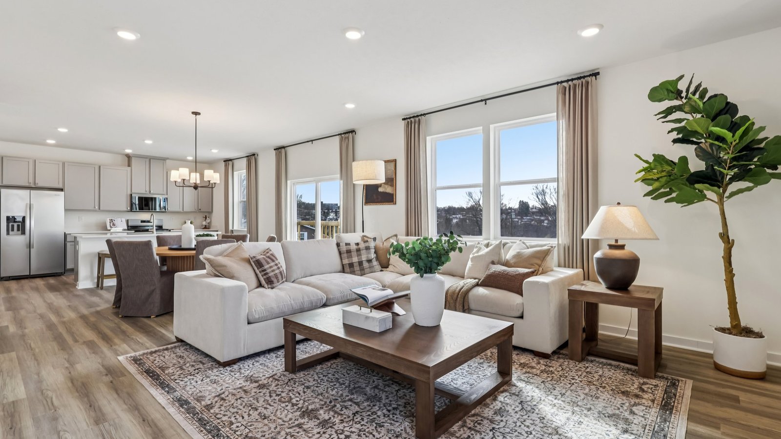 Living room off of dining and kitchen space
