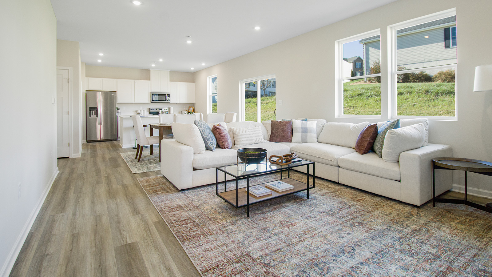 main level living room with large windows