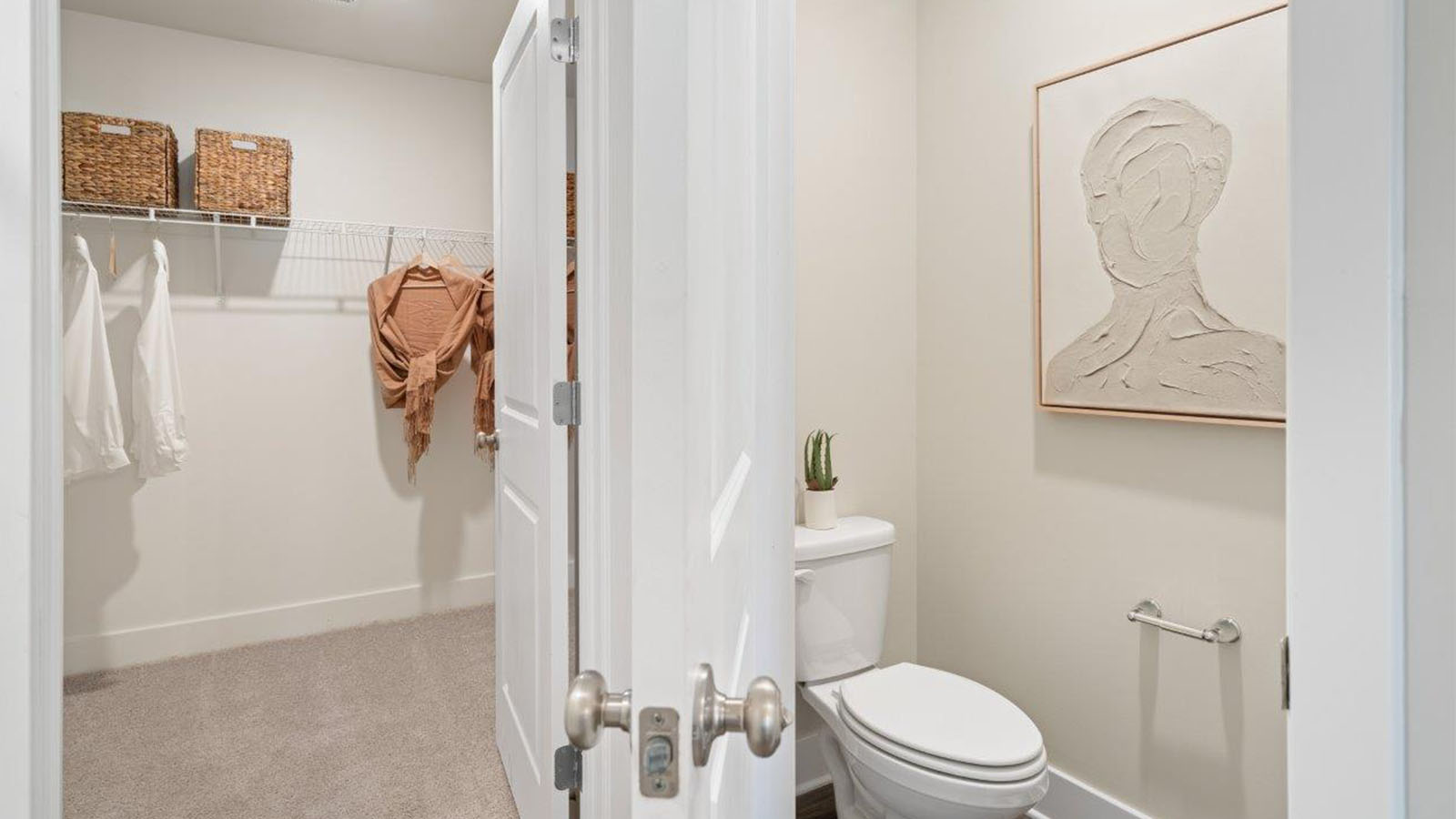 Primary ensuite bathroom toilet and closet