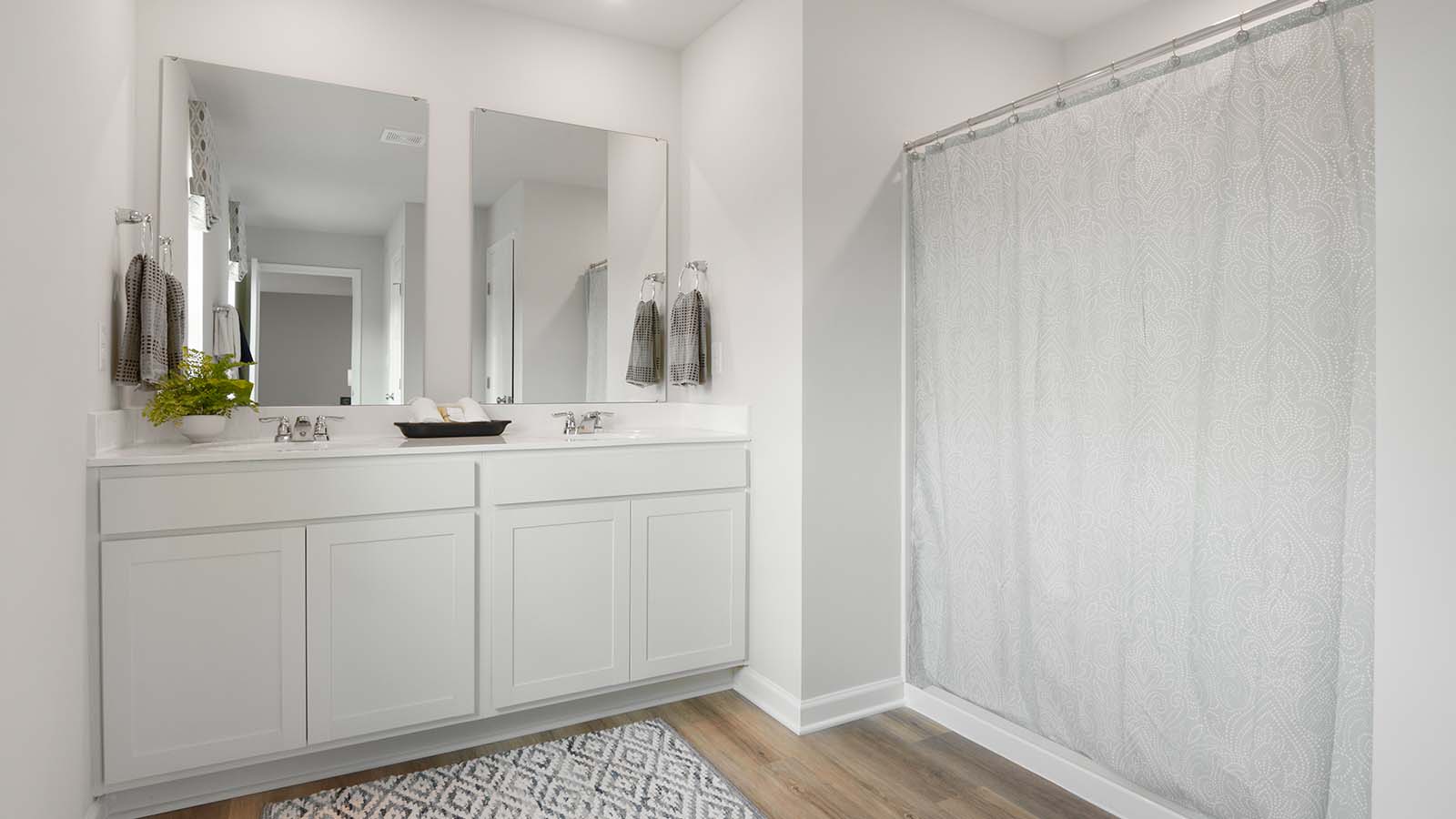 Primary ensuite bathroom with double sinks