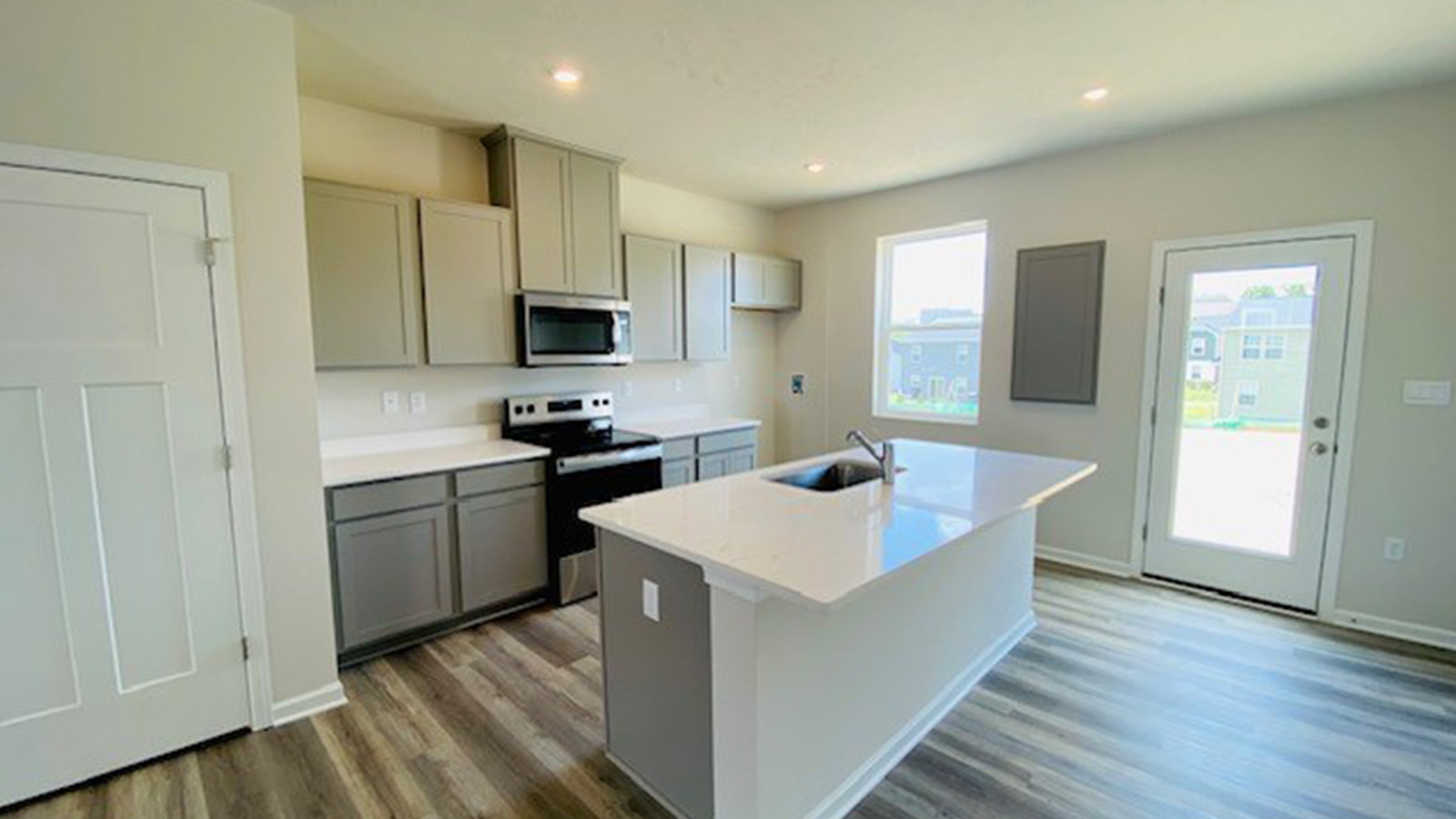 kitchen with grey cabinets and  island