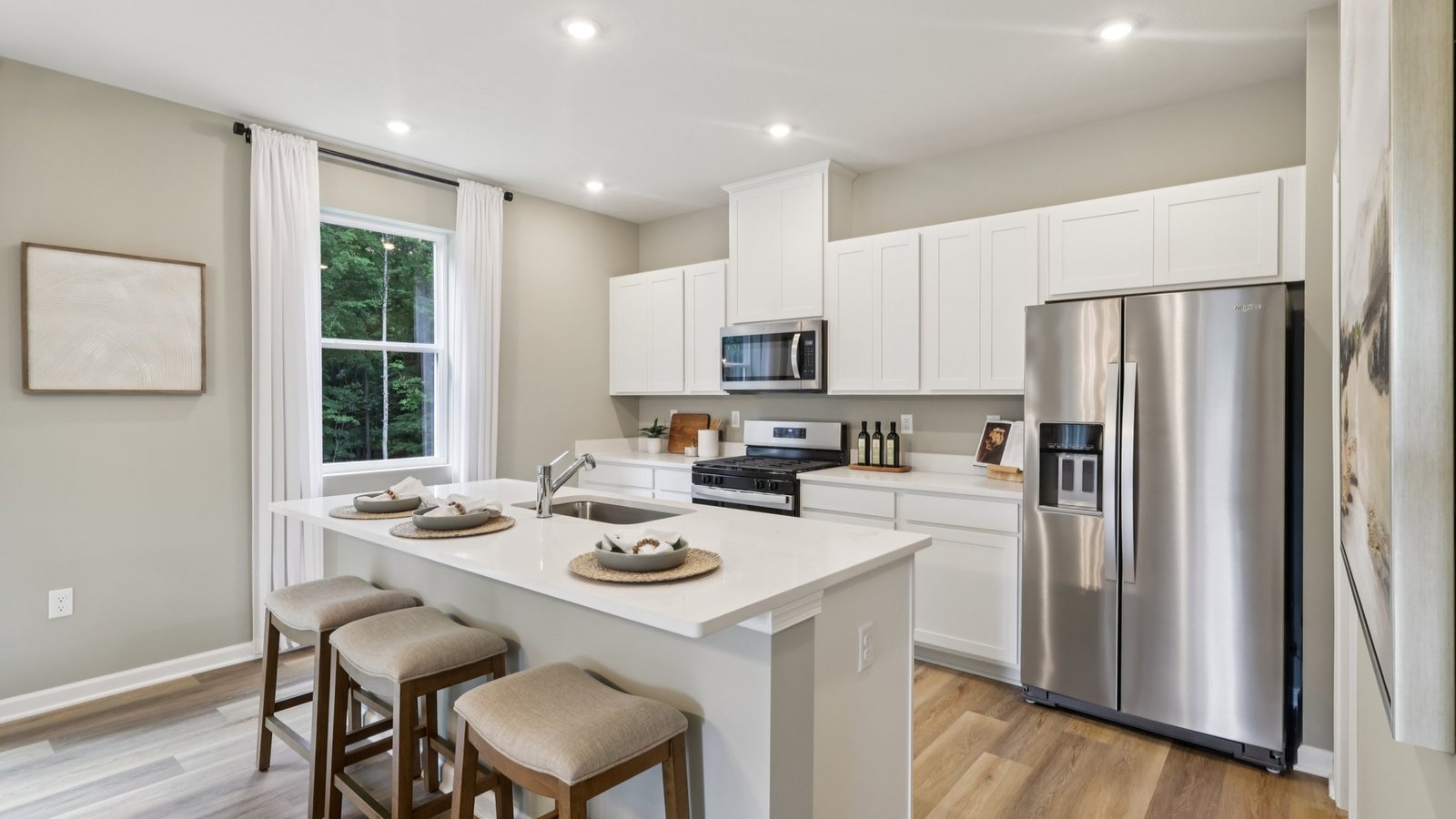Kitchen with white cabinets and countertops