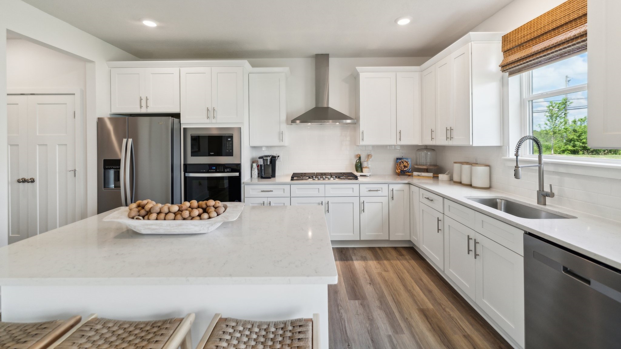 Kitchen with white cabinets and countertops