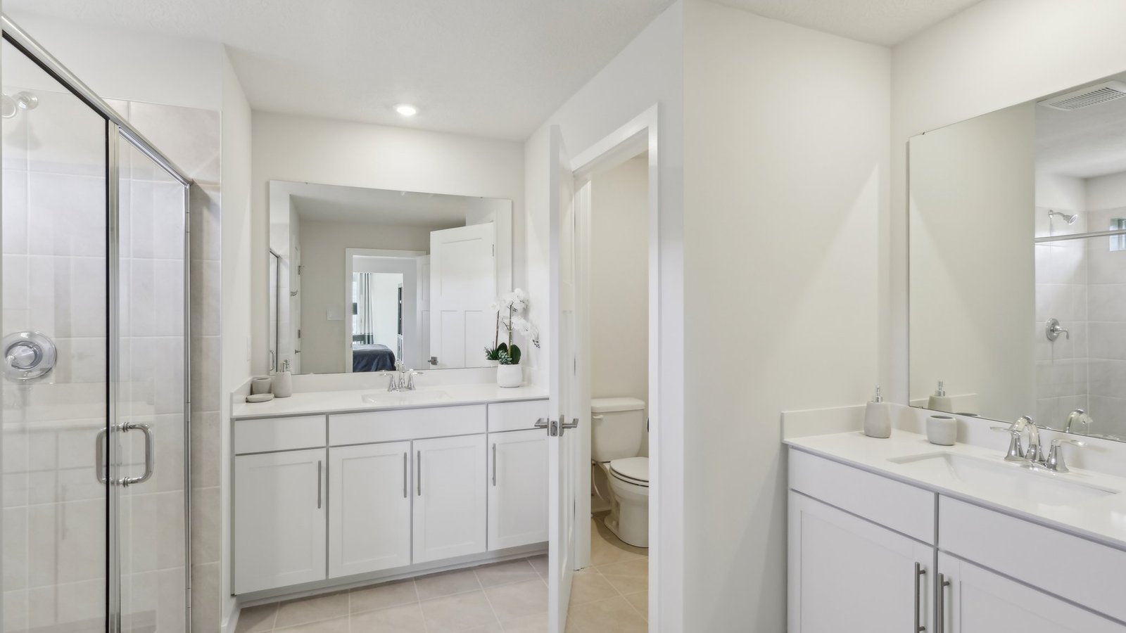 Primary ensuite bathroom with glass shower door