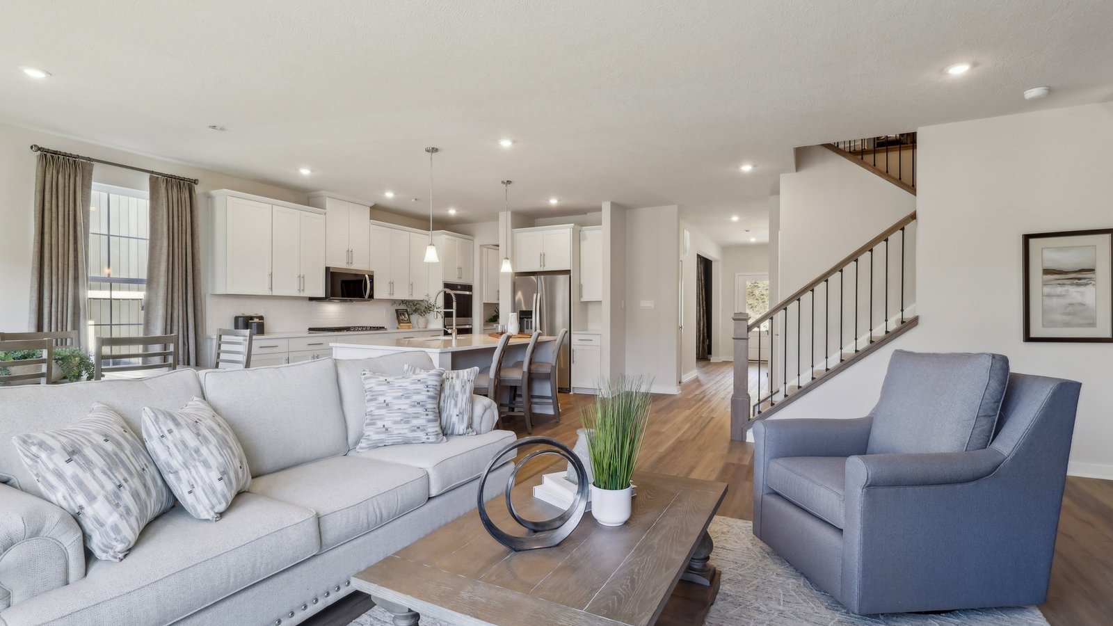 Living room off of dining and kitchen area