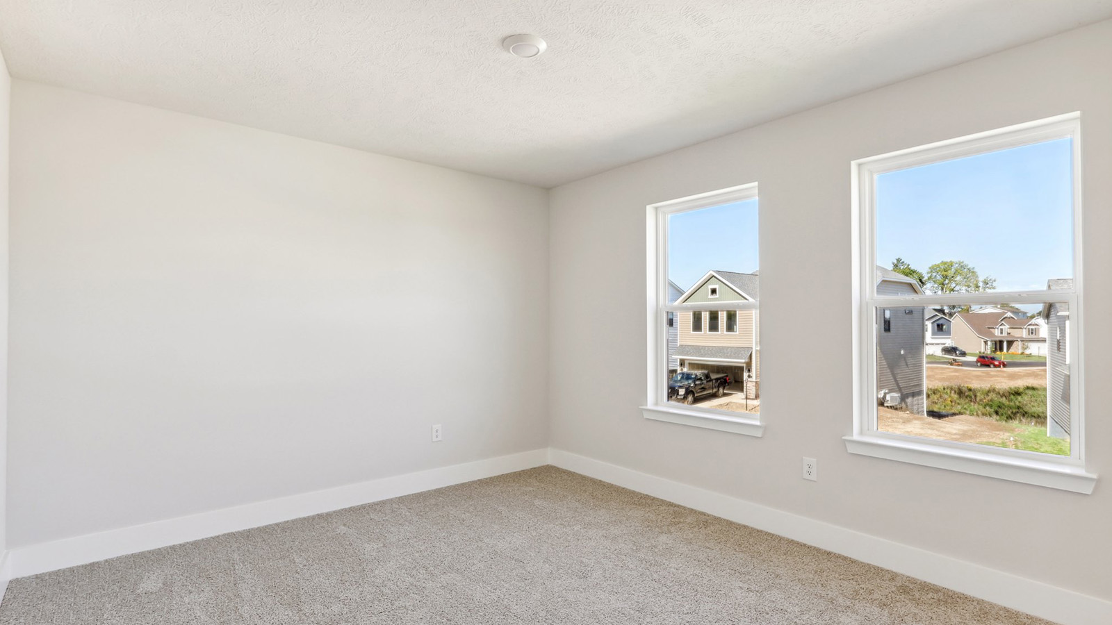 Secondary bedroom with two large windows