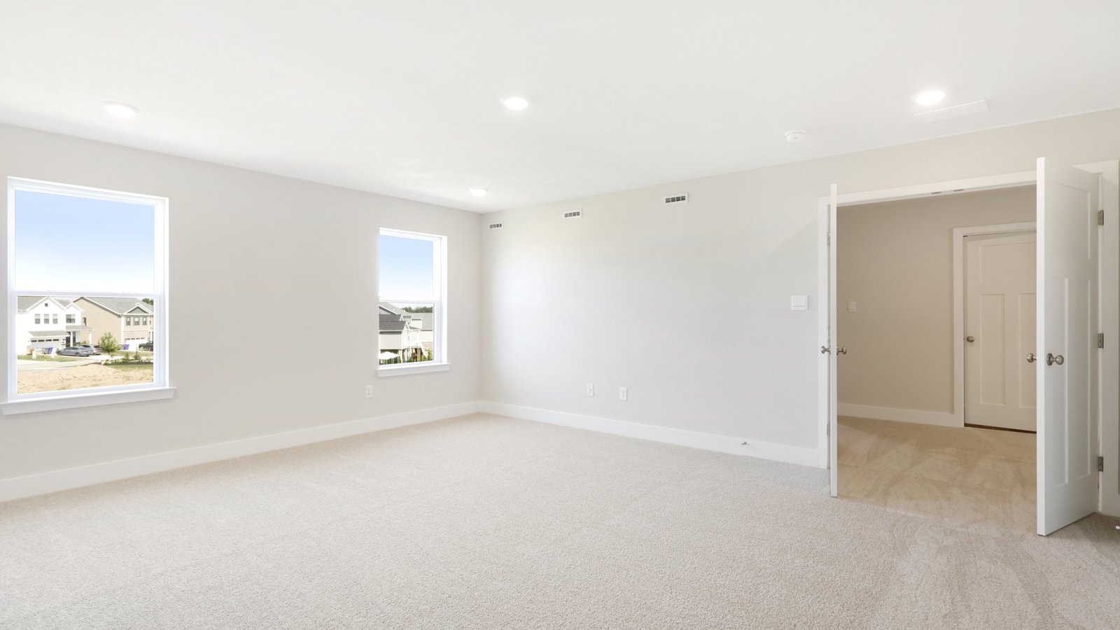 primary suite with double doors