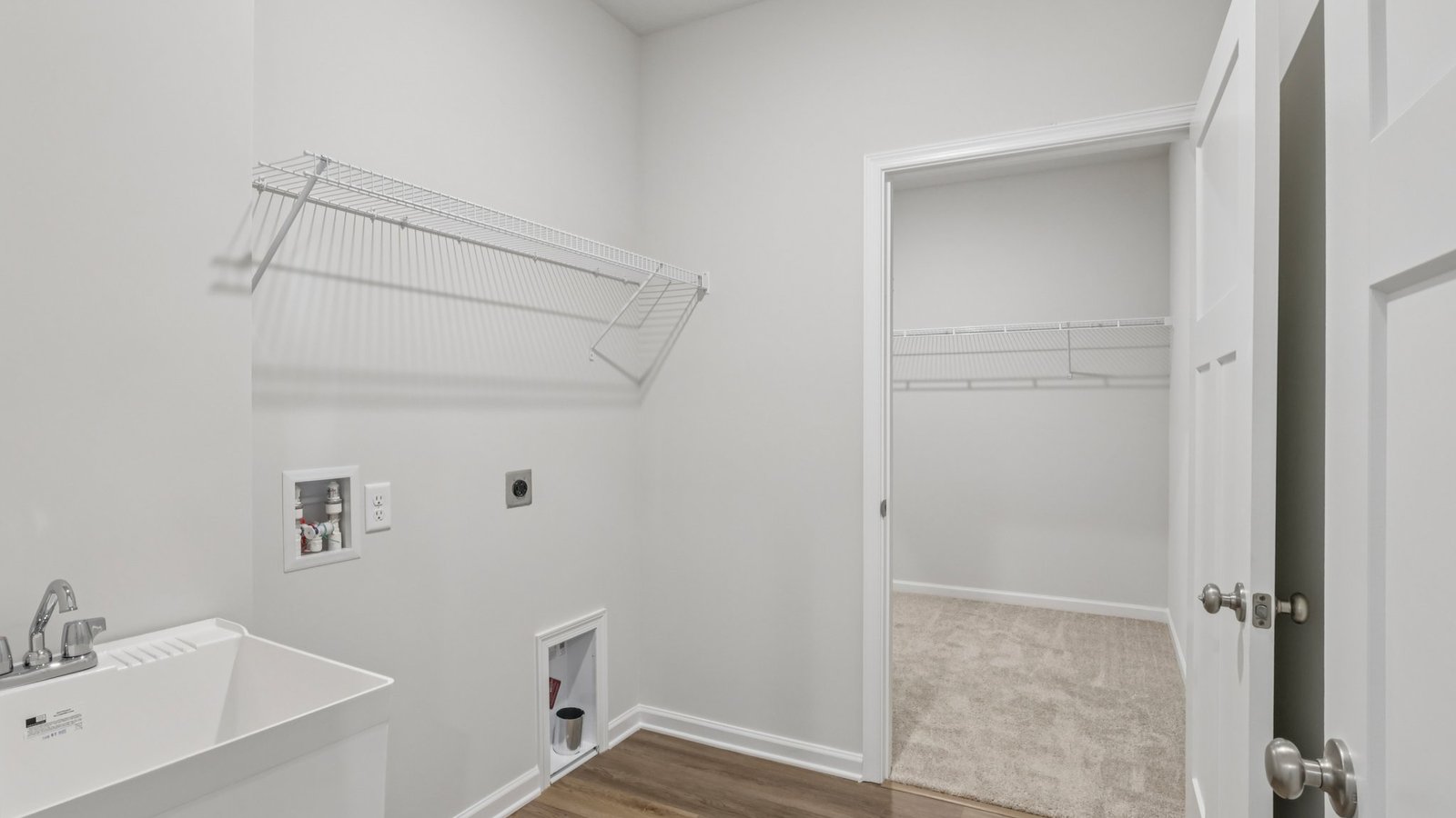 laundry area with connection to walk in closet