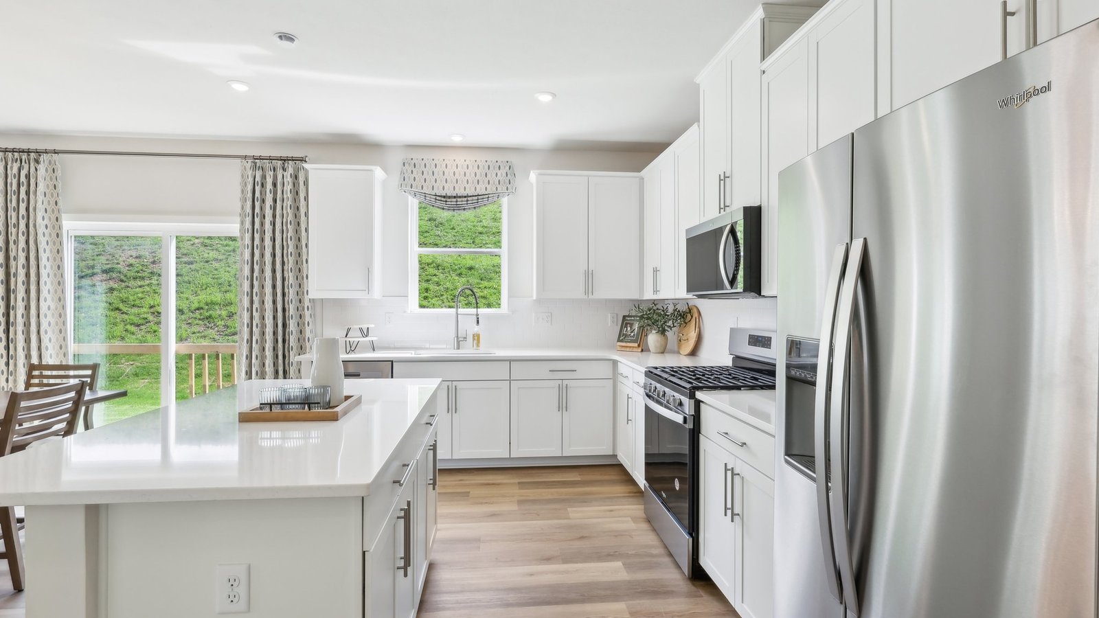 Kitchen with white cabinets and countertops