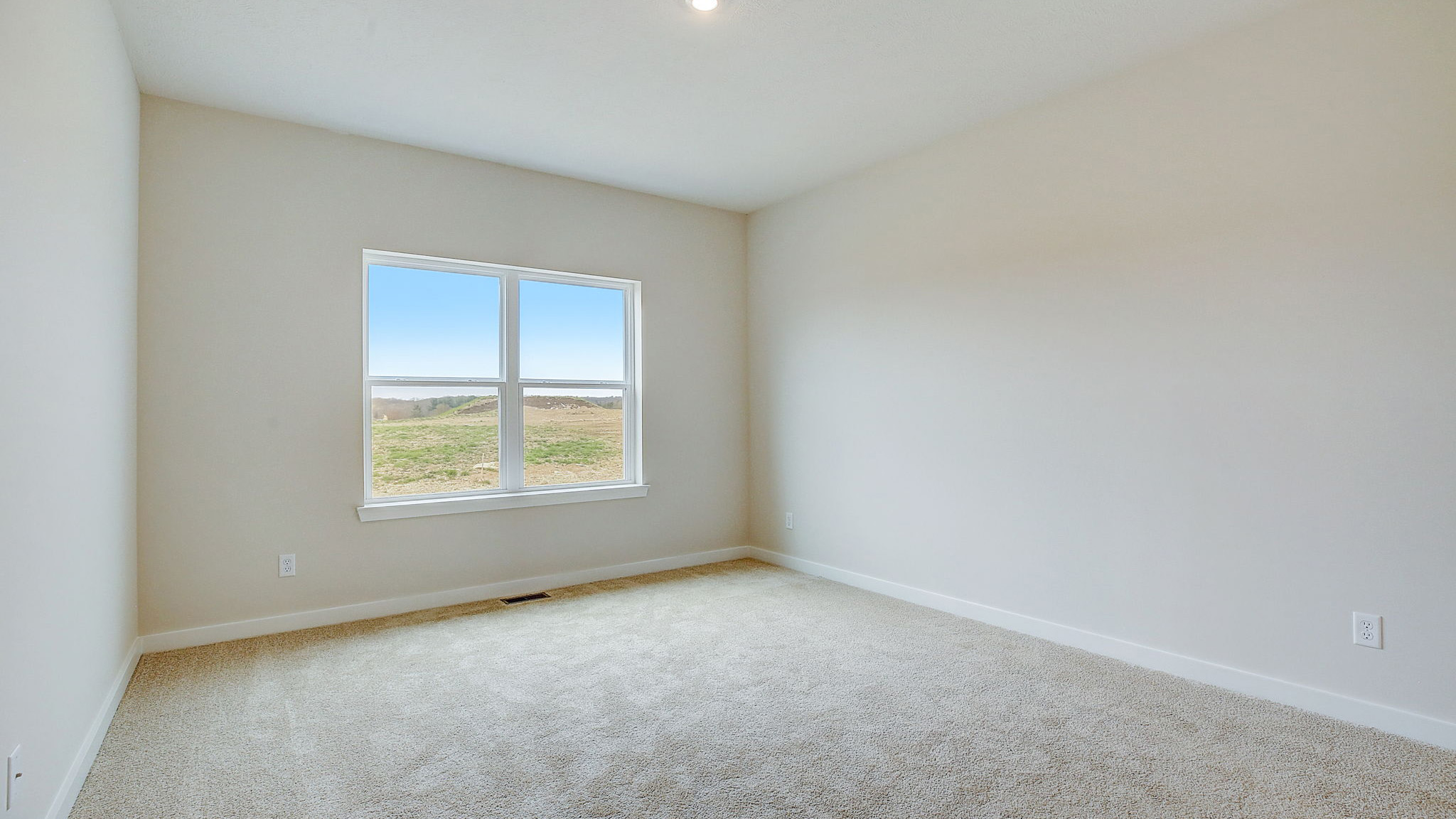 Primary bedroom with window