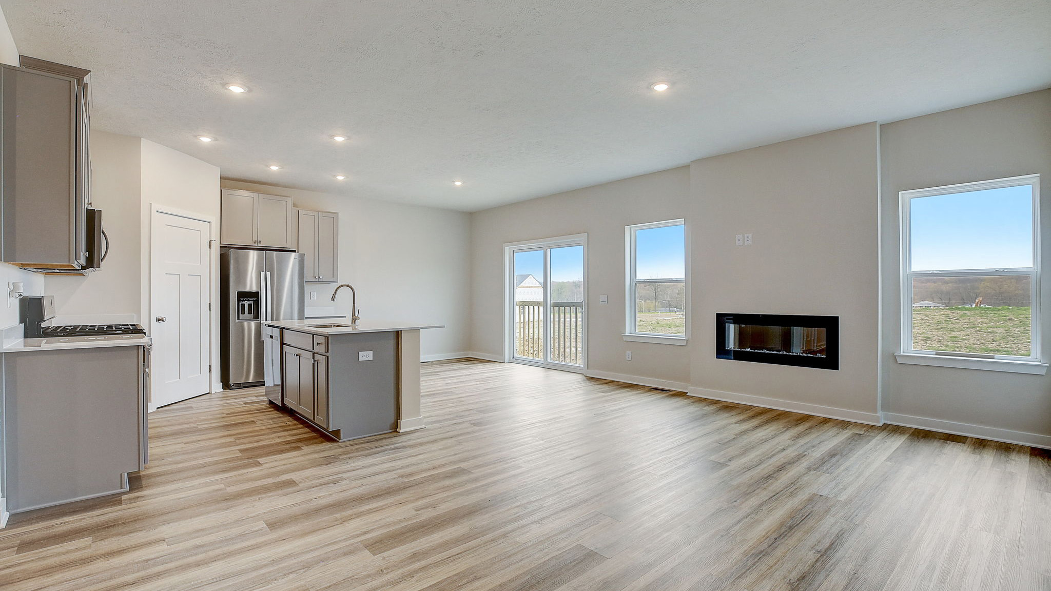 main level living area with kitchen, dining, and living areas