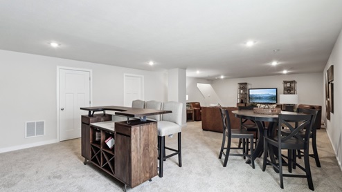 Finished basement with carpet throughout
