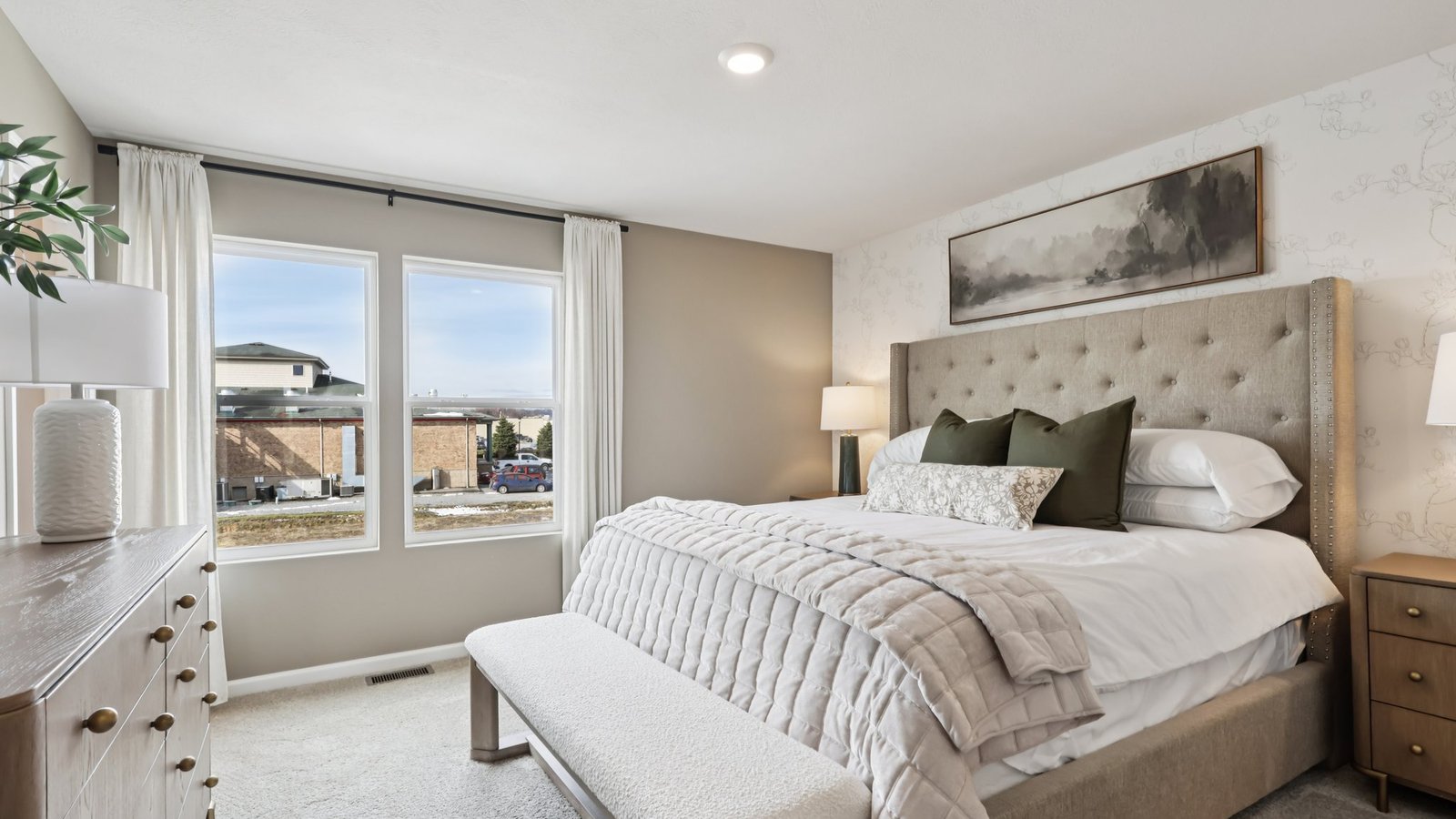 Primary bedroom with large window