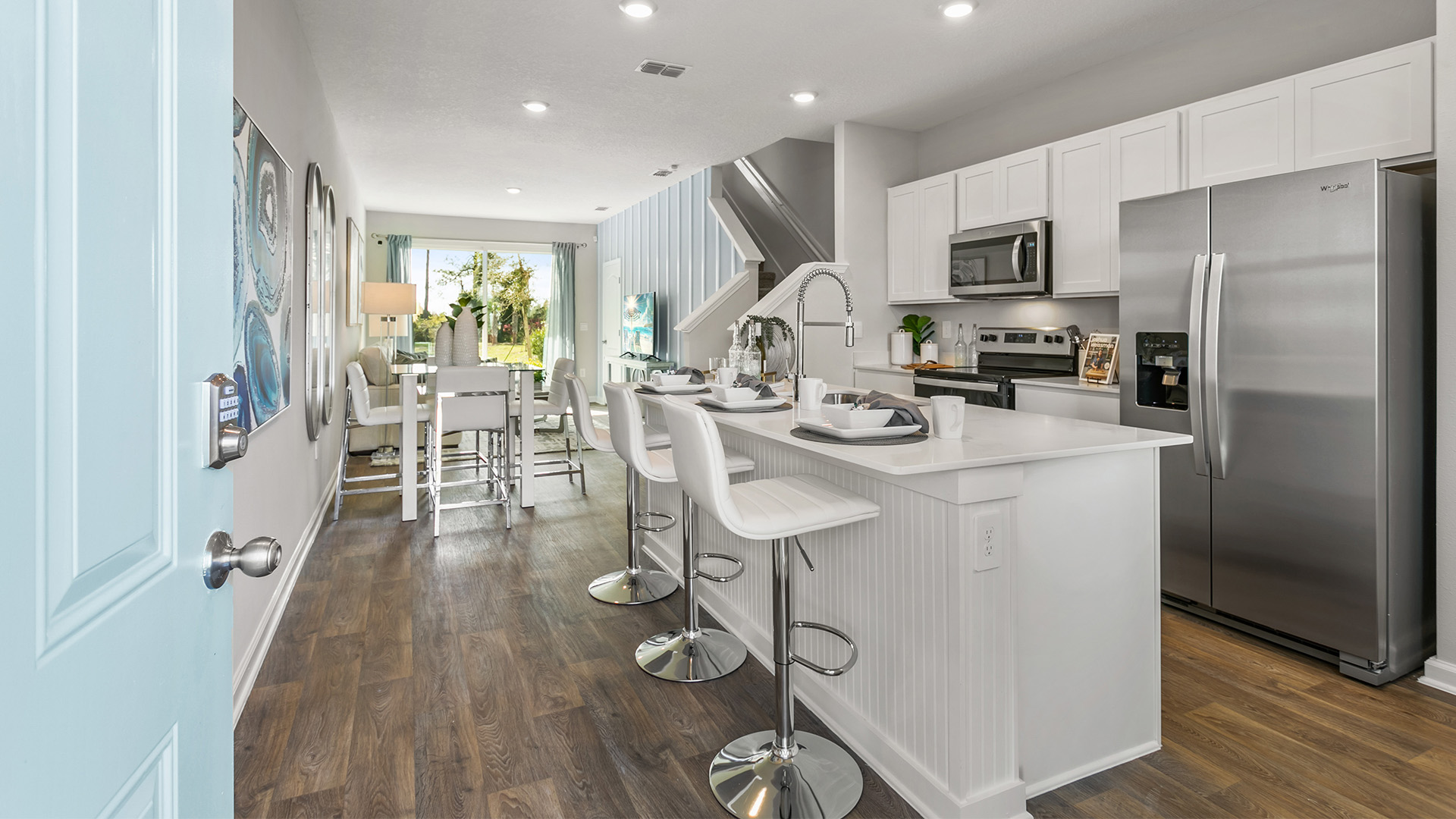 Interior kitchen with white cabinets and island