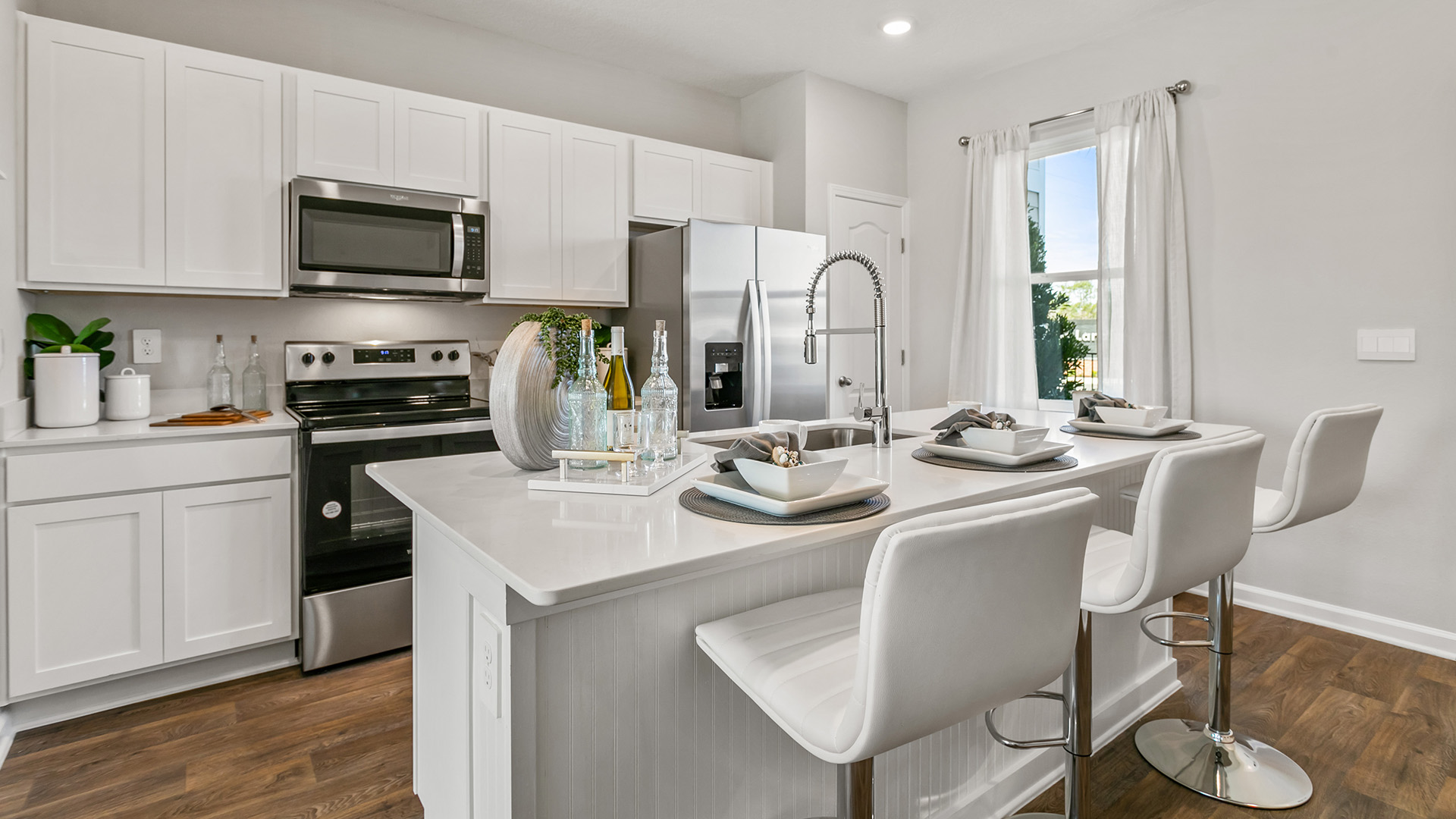 Interior kitchen with white cabinets and island