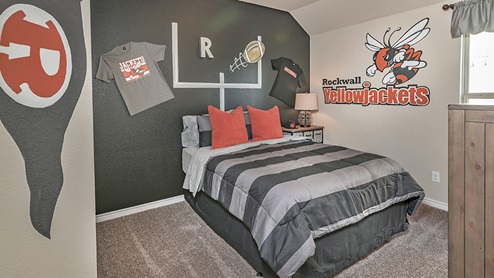 Secondary bedroom with Rockwall High School themed furniture