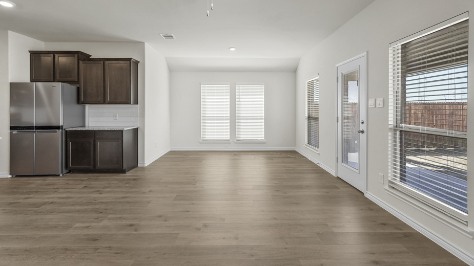 an open living area with wood floors