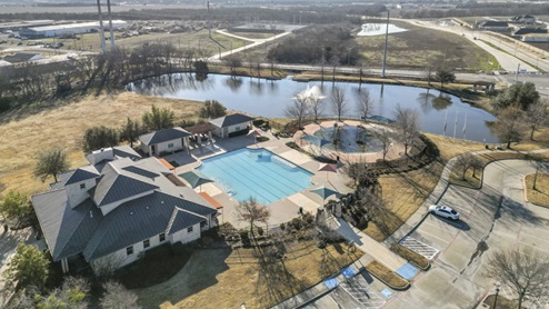Drone photo of community neighborhood center pool and large pond