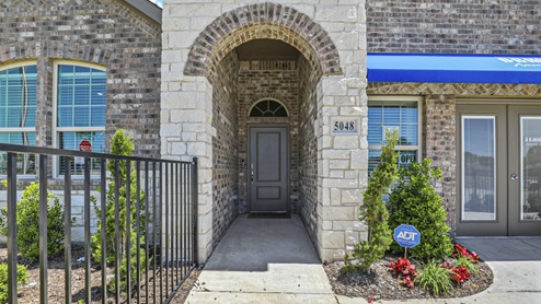 5048 Blazer Way at Fireside by the Lake in Garland, TX exterior entrance of the one story model home