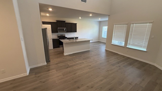 kitchen and living area with hardwood floors