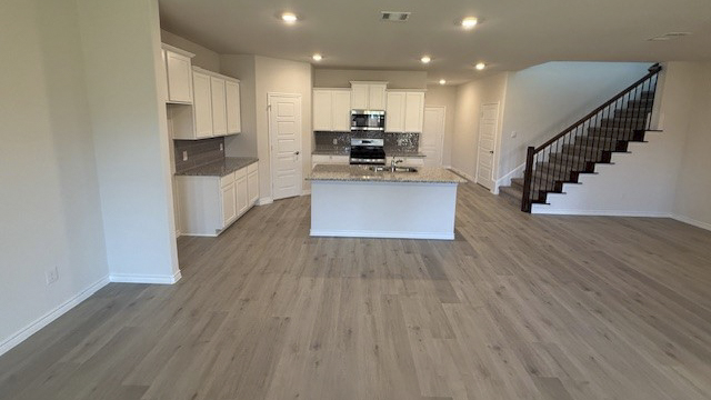 open concept living area with hardwood floors